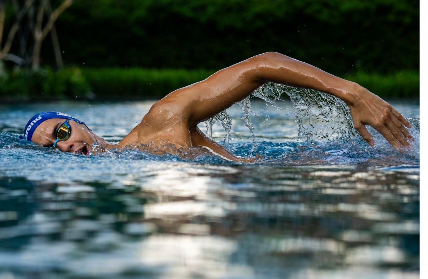 Vaggelis Makrygiannis swimming freestyle through dark water